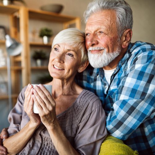 Happy romantic senior couple hugging and enjoying retirement at home Happy romantic senior couple hugging and enjoying retirement at home